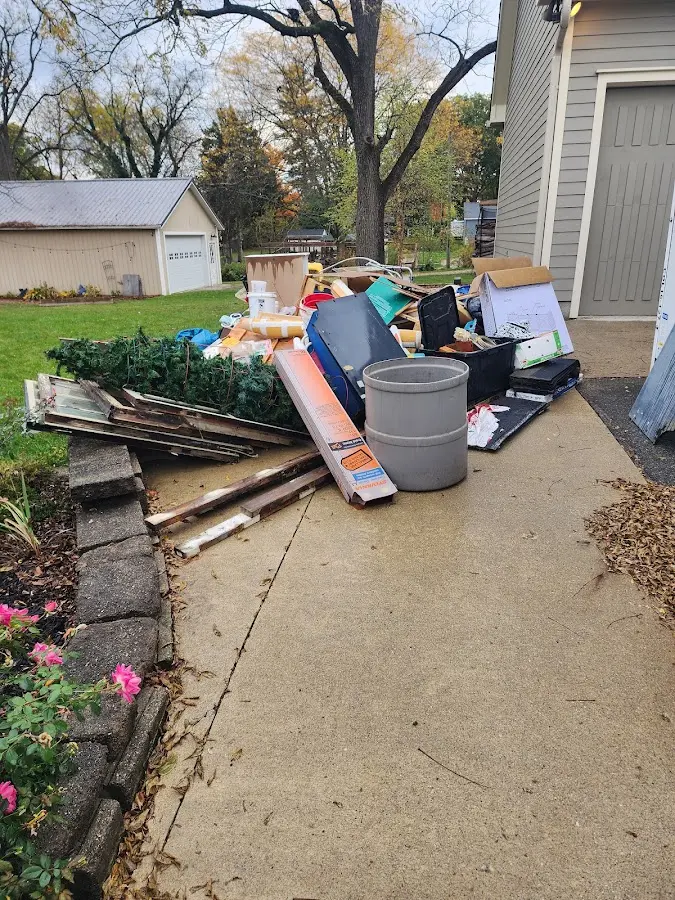 Dumpster being loaded with debris for 30 Yard Dumpster Rental in Bedminster